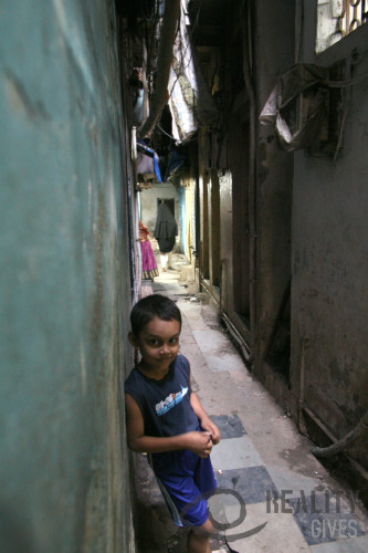 Boy in a narrow street in Dharavi