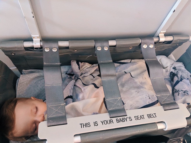 Our 9-month-old sleeping in the bassinet on a Qantas flight